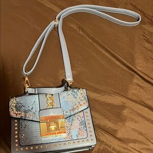 Stylish Gray Handbag with Gold Accents